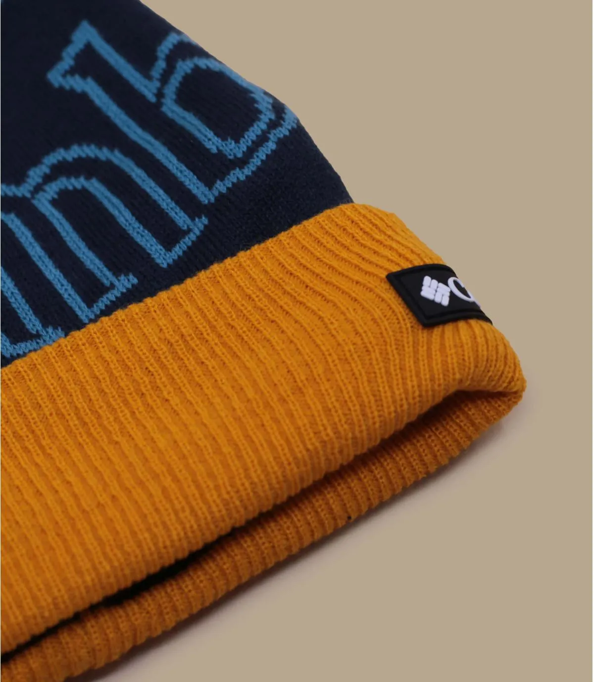 Berretto con pompon blu e giallo  Polar Powder II Beanie shasta     