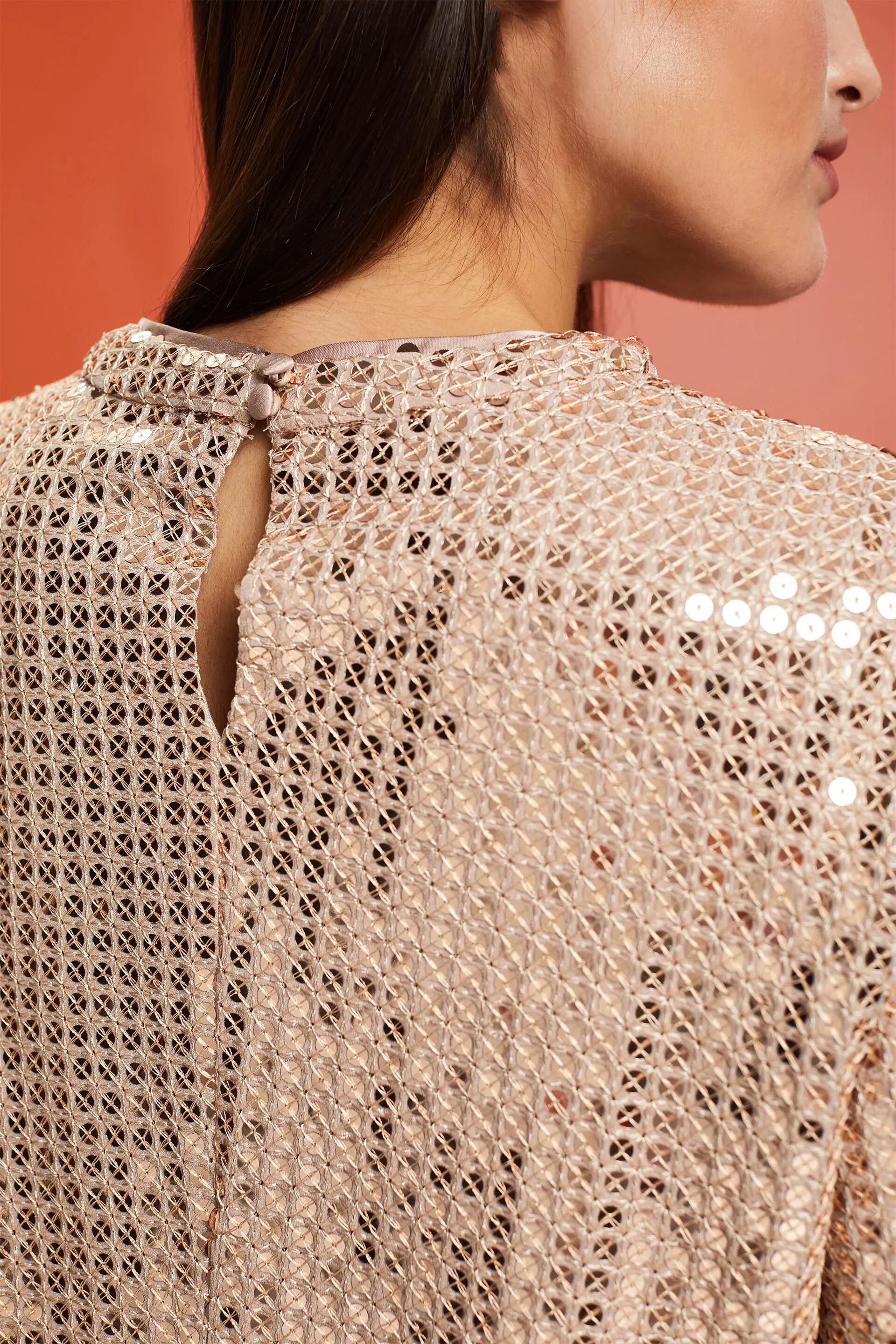 Blusa a maniche corte con paillettes