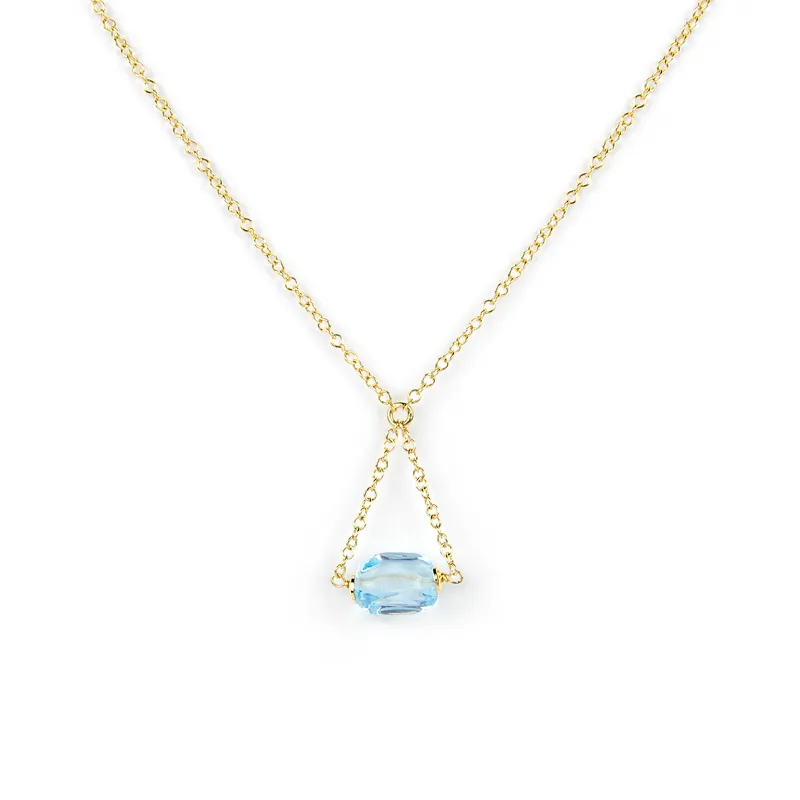 Collana in oro giallo con topazio azzurro