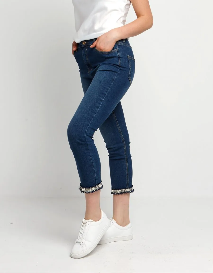 Jeans con spacco e bordura