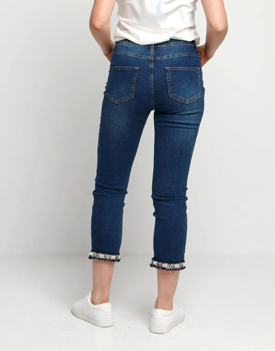 Jeans con spacco e bordura